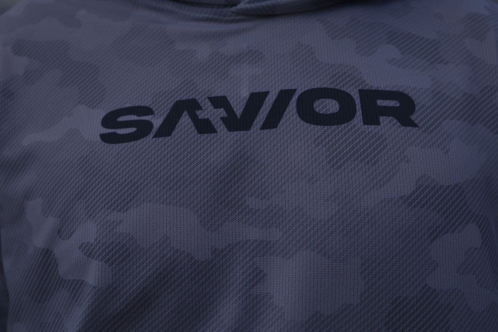 Dark camouflage hoodie with 'SAVIOR' branding on a dark background